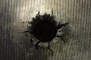 Between the Bullet and the Hole