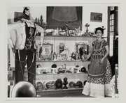 Frida Kahlo in living room with figure of Judas