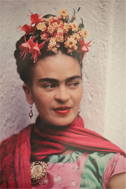 Frida Kahlo wearing a pink and green blouse