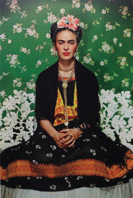 Frida Kahlo on a white bench