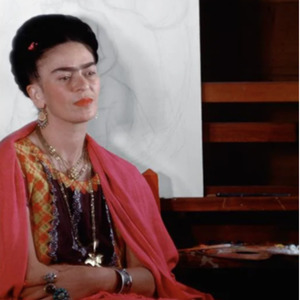 Frida Kahlo sitting by easel, early sketch of The Love Embrace by ...