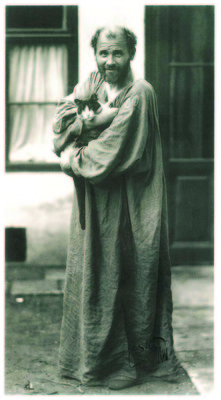 Portrait of Gustav Klimt with a cat in the garden of his studio on the Josefstadter Strasse