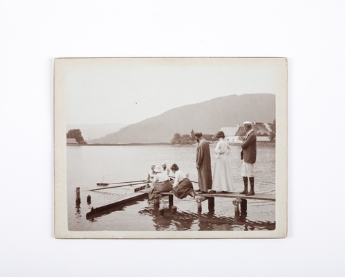 Gustav Klimt and Emilie Floge (both standing) with family and friends on a boat landing on the Attersee