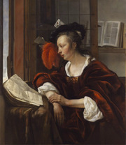 Woman Reading a Book by a Window